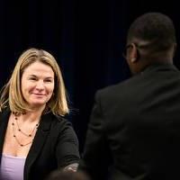 Keri Becker shakes the hand of Jerry Wallace